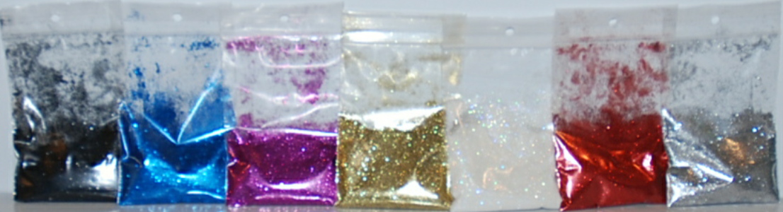 Glitters from left to right: black, blue, fuchsia, gold, iridescent, red, silver. 10g size shown.