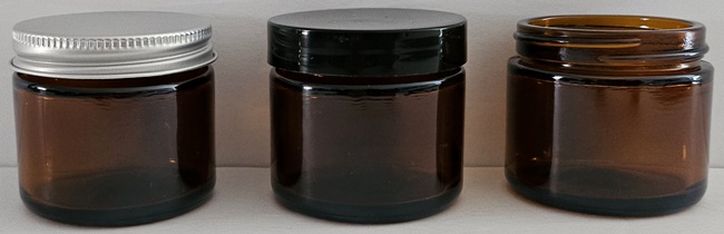 new 2 oz amber glass jar shown with caps