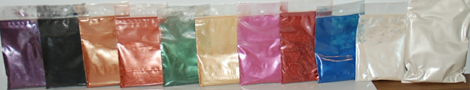 Micas from left to right: amethyst, black, bronze, copper, emerald, gold, pink, ruby, sapphire, silver, all 10g size shown and silk mica, 50g size shown.